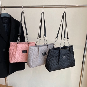 Diamond quilted nylon tote bag shown in pink, grey and black colors with chain straps