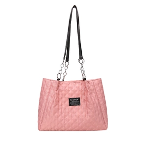 Pink quilted nylon tote bag with chain strap and fashion label in a minimalist view