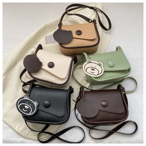 Flat lay of mini crossbody bags in khaki, cream, mint green, black and brown colors