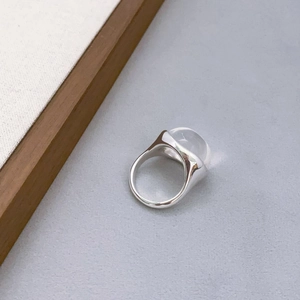 Minimalist silver ring featuring a large translucent dome crystal in a polished setting
