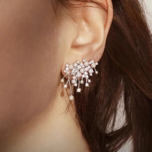 Nebula style silver stud earrings with sparkling cubic zirconia and pearl clusters