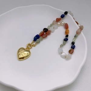 French vintage necklace with natural stone beads and large gold engraved heart pendant