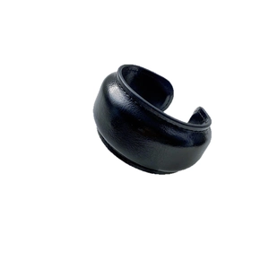 Vintage black leather C-shaped cuff bracelet with fine stitching and textured finish