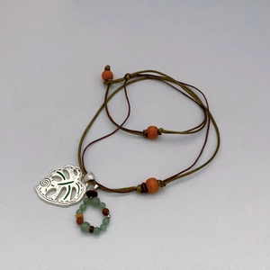 Handcrafted double-layer woven necklace featuring Monstera leaf pendant and colorful beads
