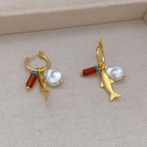 Golden hoop earrings with baroque pearl, fish charm and red chalcedony bead pendant