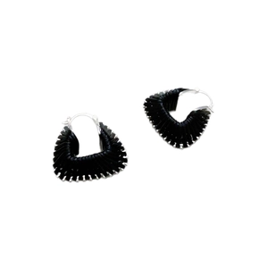Handcrafted black woven raffia heart hoop earrings with silver clasps on white background