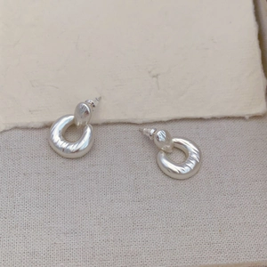 Textured sterling silver U-shaped hoop earrings with matte 18K gold finish