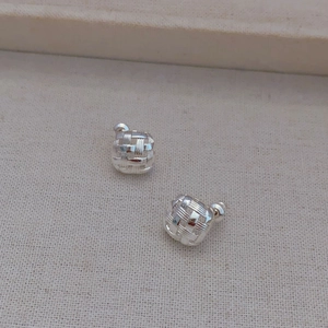 Cross woven silver stud earrings with brushed texture in geometric square design