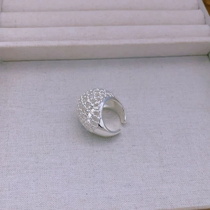 Close-up of adjustable silver open ring featuring a sophisticated hollow mesh texture