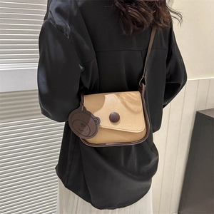 Vintage contrast saddle crossbody bag in khaki and brown with a cute bear charm pendant