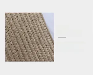 Détail macro du tissu en corde de coton tissé main avec une texture sergé compacte