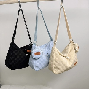Three checkered canvas shoulder bags in black, blue, and white with mini coin pouches