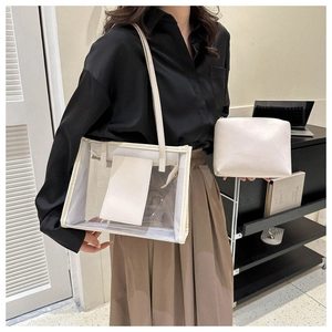 Three-piece set detail: large PVC tote with inner liner and matching makeup pouch