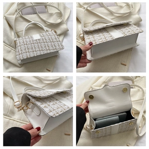 Detail view of tweed crossbody bag showing the woven fabric and gold hardware features