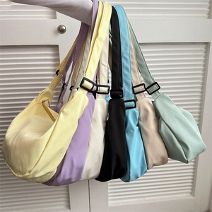 Versatile nylon crescent crossbody bags in multiple colors with adjustable straps
