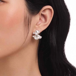 Elegant double-layered skirt fan stud earrings with sparkling cubic zirconia on models ear