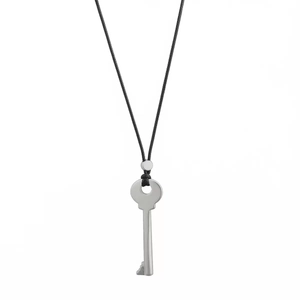 Detailed view of a polished silver key pendant hanging on a long black adjustable cord