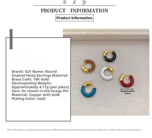 Detail of 18K gold plated brass enamel earrings in five colors on a textured tray