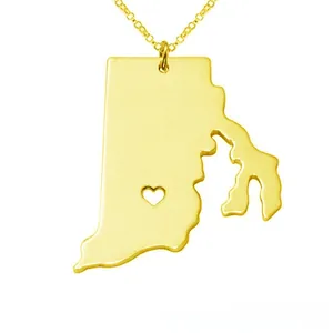 Macro detail of Rhode Island map pendant with heart cutout on gold chain necklace