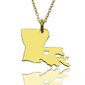 Macro shot of Louisiana state map pendant with heart cutout in gold stainless steel