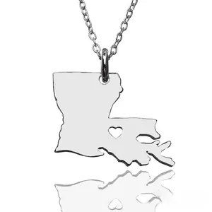 Detail of silver Louisiana state map pendant with hollow heart on a delicate chain