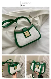 Detail view of green and white patchwork shoulder bag with quilted pattern and gold lock