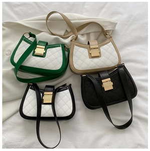 Flat lay of quilted shoulder bags in green, beige, black, and white patchwork styles