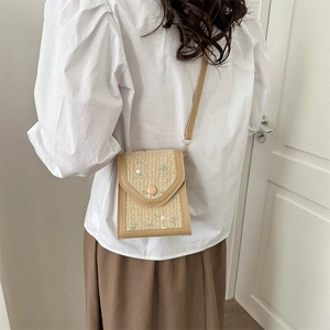 Vintage straw crossbody bag with floral embroidery and adjustable leather strap