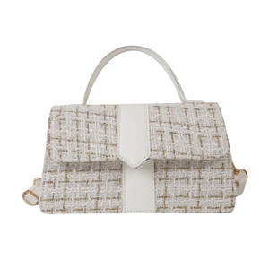 Elegant white tweed handbag with gold weave, featuring leather top handle and crossbody strap