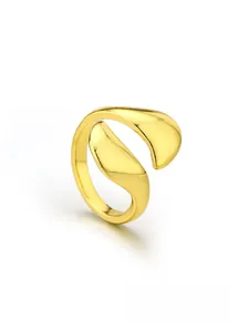 Polished gold adjustable nail ring with asymmetric streamlined organic design on white