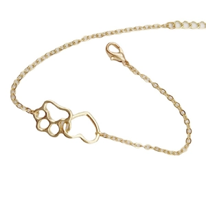 Golden alloy chain bracelet featuring interlocking hollow heart and paw print charms