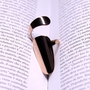 Polished rose gold nail ring featuring a two-section adjustable open band design