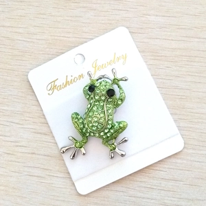 Creative cartoon frog brooch with sparkling green rhinestones on white display card
