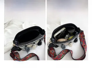 Internal view of bohemian tassel bucket bag showing zip pocket and daily essentials