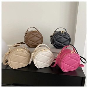 Collection of quilted semi-circle handbags in brown, black, beige, white, and pink colors