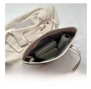 Interior view showing large capacity for umbrella and wallet in red check tote bag