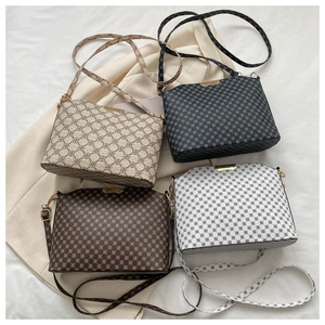 Collection of vintage monogram shoulder bags in four colors with adjustable straps