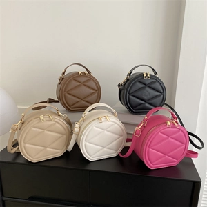 Minimalist round quilted handbag set in five colors with top handle and crossbody strap