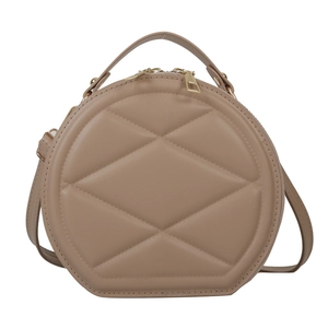 Quilted round crossbody bag in beige PU leather with top handle and golden hardware