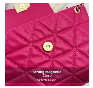 Detail of rose red quilted bag showing the strong magnetic buckle and gold hardware