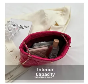 Internal capacity of rose pink quilted chain bag holding phone and cosmetics