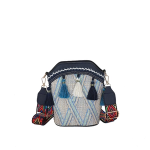 Ethnic style bucket bag with beige and blue weaving, tassels and jacquard shoulder strap