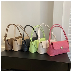 Detail of quilted leather bags in six colors with metallic locks and knotted straps