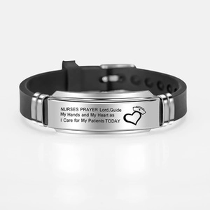 Detailed engraving of Nurses Prayer on stainless steel band with black silicone strap