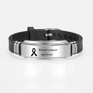 Black silicone bracelet featuring silver metal plate with Breast cancer survivor text