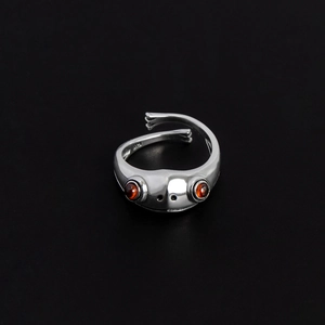 Silver frog ring with carnelian eyes and S925 stamp in an adjustable open band design