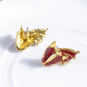 Gothic gold-plated dragon wing stud earrings with sparkling red enamel finish