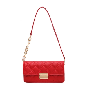 Chic red quilted crossbody bag with golden clasp and chain strap on white background