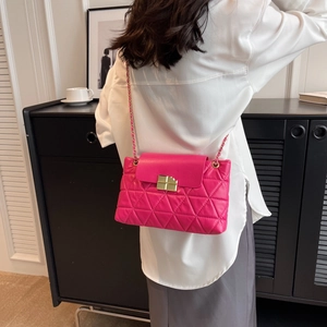 Fuchsia quilted chain shoulder bag with diamond pattern and gold metallic clasp closure