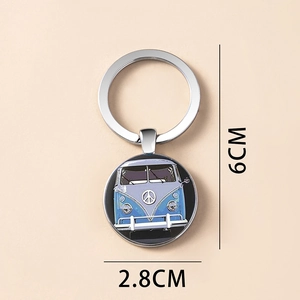Detail view of vintage alloy keychain featuring a blue retro bus graphic in a 2.8CM charm